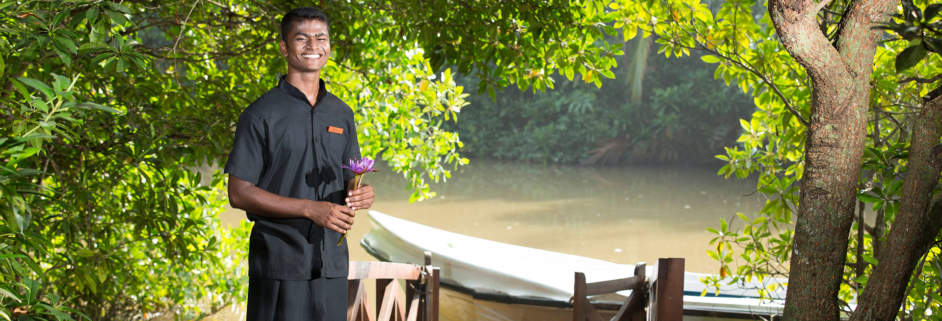 waiter standing by a boat